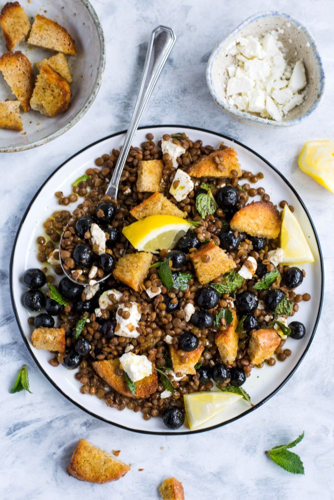 lentil salad with blueberries, feta, and bread croutons