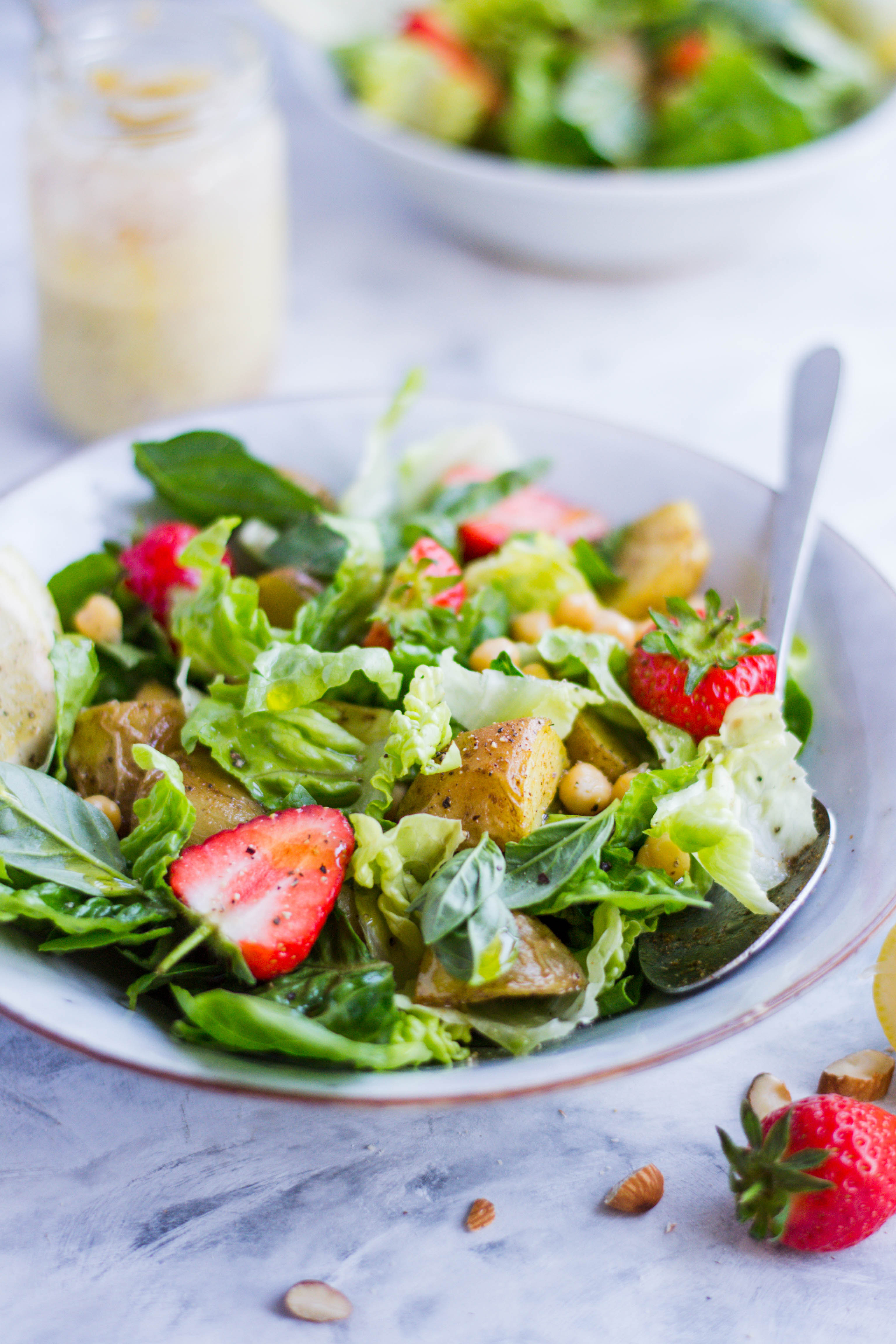 potato, strawberry, and chickpea salad with the easiest nut butter dressing